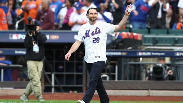 Oct 9, 2024; New York, New York, USA; New York Mets former infielder Daniel Murphy throws out the ceremonial first pitch before game four of the NLDS for the 2024 MLB Playoffs against the Philadelphia Phillies at Citi Field. Mandatory Credit: Wendell Cruz-Imagn Images