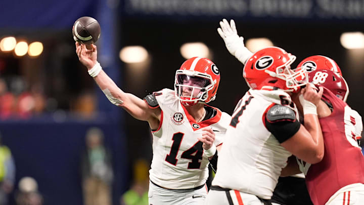 Dec 6, 2025; Atlanta, GA, USA; Georgia Bulldogs quarterback Gunner Stockton (14) throws a pass during the second quarter against the Alabama Crimson Tide during the 2025 SEC Championship game at Mercedes-Benz Stadium. Mandatory Credit: Dale Zanine-Imagn Images Dec 6, 2025; Atlanta, GA, USA; Georgia Bulldogs quarterback Gunner Stockton (14) throws a pass during the second quarter against the Alabama Crimson Tide during the 2025 SEC Championship game at Mercedes-Benz Stadium. Mandatory Credit: Dale Zanine-Imagn Images