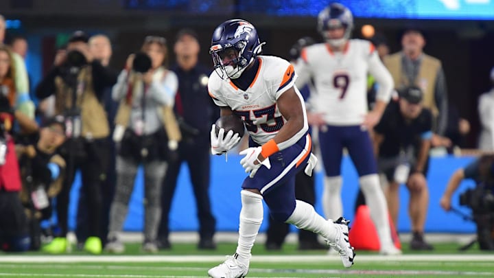 Denver Broncos running back Javonte Williams runs the ball against the Los Angeles Chargers during the first half at SoFi Stadium. 