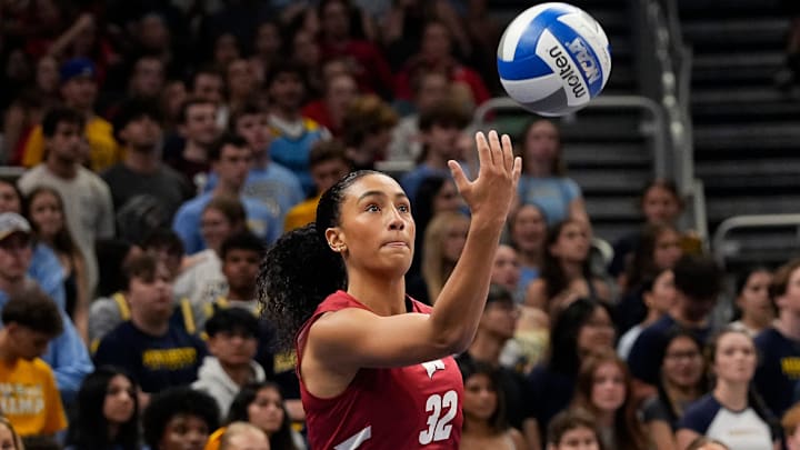 Wisconsin Badgers outside hitter Grace Egan (32) prepares to serve the ball during the first set of the match against the Marquette Golden Eagles on Wednesday September 17, 2025 at Fiserv Forum in Milwaukee, Wisconsin.
