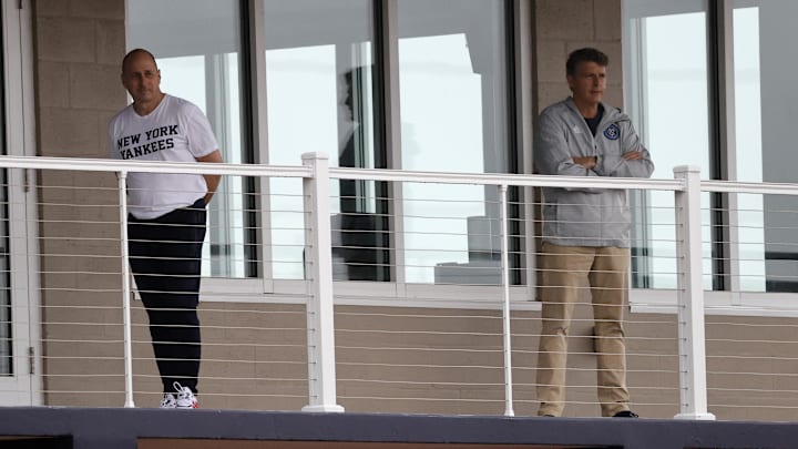 Feb 19, 2021; Tampa, Florida, USA; New York Yankees general manager Brian Cashman and owner Hal