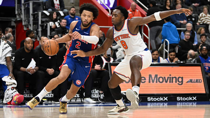 Nov 1, 2024; Detroit, Michigan, USA; Detroit Pistons guard Cade Cunningham (2) drives past New York Knicks forward OG Anunoby (8)  in the second quarter at Little Caesars Arena. Mandatory Credit: Lon Horwedel-Imagn Images