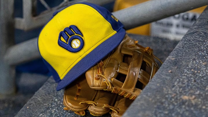 Apr 21, 2026; Detroit, Michigan, USA; A Milwaukee Brewers hat and glove in the dugout during the seventh inning against the Detroit Tigers at Comerica Park. Mandatory Credit: David Reginek-Imagn Images