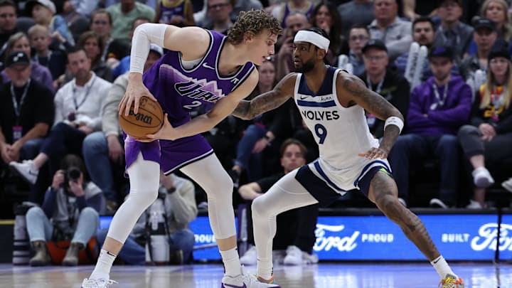 Mar 18, 2024; Salt Lake City, Utah, USA; Utah Jazz forward Lauri Markkanen (23) looks to move the ball against Minnesota Timberwolves guard Nickeil Alexander-Walker (9) during the fourth quarter at Delta Center. Mandatory Credit: Rob Gray-Imagn Images