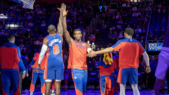 Oct 26, 2024; Detroit, Michigan, USA; Detroit Pistons center Jalen Duren (0) is introduced and hi-fives forward Tim Hardaway Jr. (8) during the in the first half at Little Caesars Arena. Mandatory Credit: David Reginek-Imagn Images