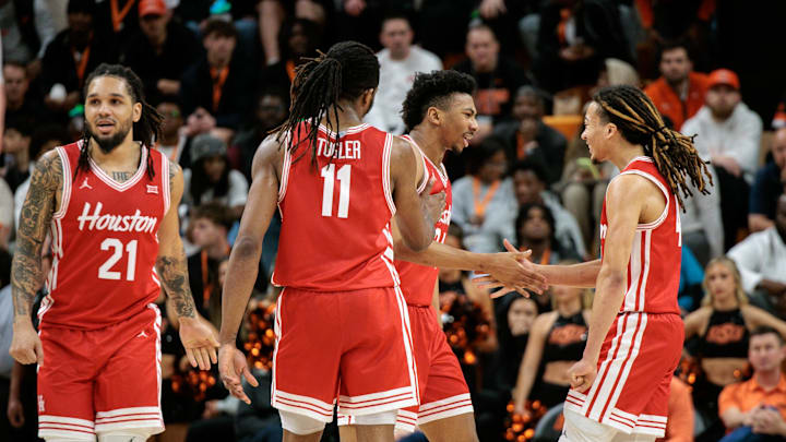 Mar 7, 2026; Stillwater, Oklahoma, USA; Houston Cougars guard Emanuel Sharp (21) and Houston Cougars guard Kingston Flemings (4) react after a play during the second half against the Oklahoma State Cowboys at Gallagher-Iba Arena. Mandatory Credit: William Purnell-Imagn Images Mar 7, 2026; Stillwater, Oklahoma, USA; Houston Cougars guard Emanuel Sharp (21) and Houston Cougars guard Kingston Flemings (4) react after a play during the second half against the Oklahoma State Cowboys at Gallagher-Iba Arena. Mandatory Credit: William Purnell-Imagn Images