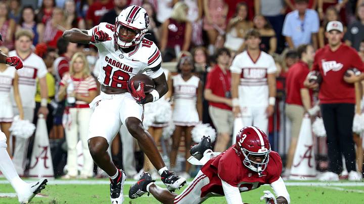 Sep 26, 2026; Tuscaloosa, Alabama, USA;  South Carolina Gamecocks wide receiver Stone Furrey (18) avoids a tackle by Alabama Crimson Tide defensive back Keon Sabb (3) during the second quarter at Saban Field at Bryant-Denny Stadium.  Mandatory Credit: David Leong-Imagn Images