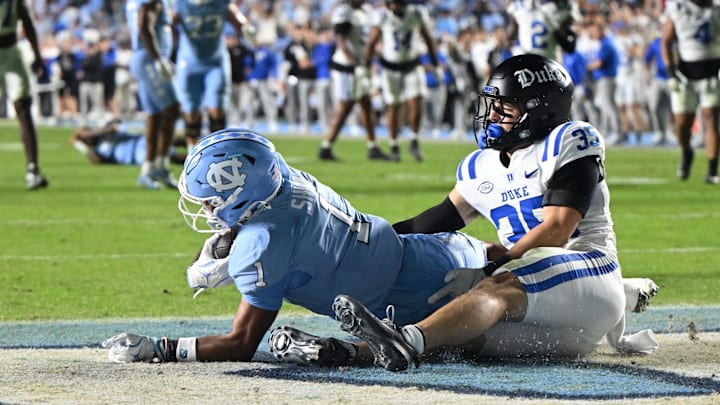 Nov 22, 2025; Chapel Hill, North Carolina, USA; North Carolina Tar Heels wide receiver Jordan Shipp (1) scores a touchdown during the second half at Kenan Stadium. Mandatory Credit: William Howard-Imagn Images