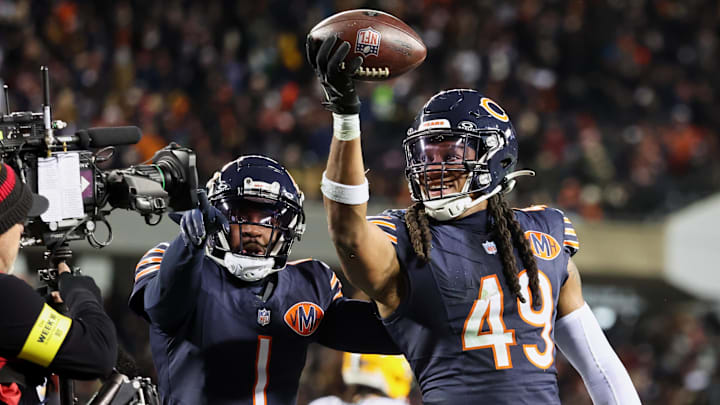 Dec 20, 2025; Chicago, Illinois, USA; Chicago Bears linebacker Tremaine Edmunds (49) poses for a television camera with cornerback Jaylon Johnson (1) after recovering a fumble against the Green Bay Packers during the third quarter at Soldier Field. Mandatory Credit: Mike Dinovo-Imagn Images