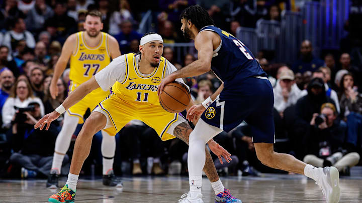 Jan 20, 2026; Denver, Colorado, USA; Denver Nuggets guard Jamal Murray (27) controls the ball as Los Angeles Lakers center Jaxson Hayes (11) guards in the fourth quarter at Ball Arena. Mandatory Credit: Isaiah J. Downing-Imagn Images