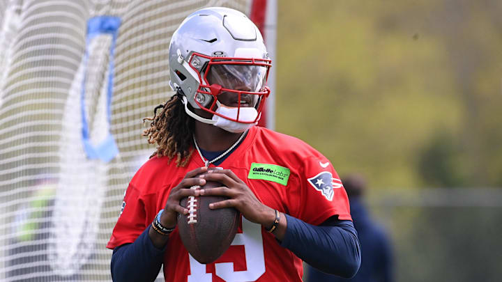 May 11, 2024; Foxborough, MA, USA; New England Patriots quarterback Joe Milton III (19) throws a pass at the New England Patriots rookie camp at Gillette Stadium.  Mandatory Credit: Eric Canha-USA TODAY Sports