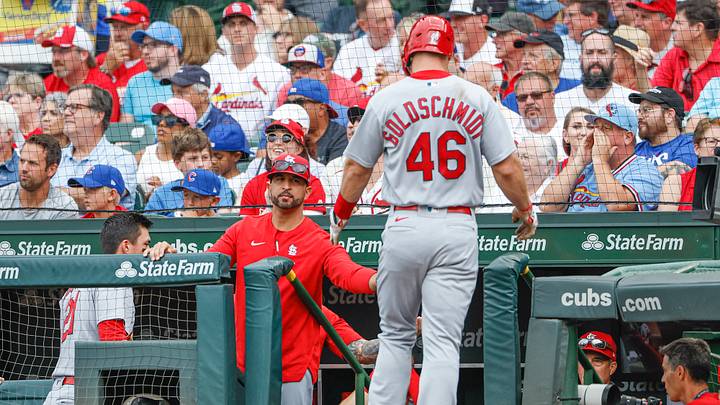 Aug 25, 2022; Chicago, Illinois, USA; St. Louis Cardinals first baseman Paul Goldschmidt (46) is congratulated by manager Oliver Marmol (37) after scoring a run against the Chicago Cubs during the first inning at Wrigley Field. Mandatory Credit: Kamil Krzaczynski-USA TODAY Sports Aug 25, 2022; Chicago, Illinois, USA; St. Louis Cardinals first baseman Paul Goldschmidt (46) is congratulated by manager Oliver Marmol (37) after scoring a run against the Chicago Cubs during the first inning at Wrigley Field. Mandatory Credit: Kamil Krzaczynski-USA TODAY Sports