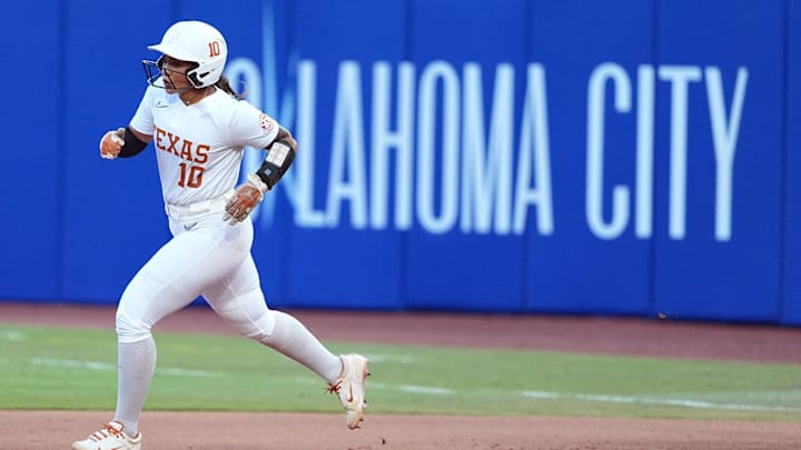 Texas's Mia Scott runs the bases after hitting a grand slam in the fourth inning during the Women's College World Series championship game between Texas Tech and Texas at Devon Park, Friday, June, 6, 2025, in Oklahoma City.
