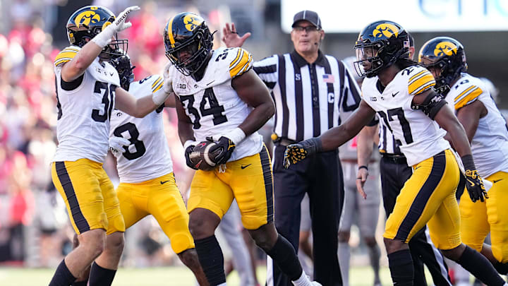 Oct 5, 2024; Columbus, OH, USA; Iowa Hawkeyes linebacker Jay Higgins (34) celebrates a fumble recovery after forcing Ohio State Buckeyes wide receiver Jeremiah Smith to lose the ball during the first half of the NCAA football game at Ohio Stadium.