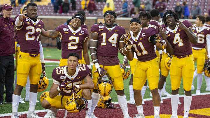 Oct 5, 2019; Minneapolis, MN, USA; From left to right Minnesota Golden Gophers defensive back Tyler Nubin (27), defensive back Phillip Howard (2), defensive back Benjamin St-Juste (25), linebacker Braelen Oliver (14), defensive back Antoine Winfield Jr. (11), and defensive back Terell Smith (4) celebrate after defeating the Illinois Fighting Illini at TCF Bank Stadium. Mandatory Credit: Jesse Johnson-Imagn Images