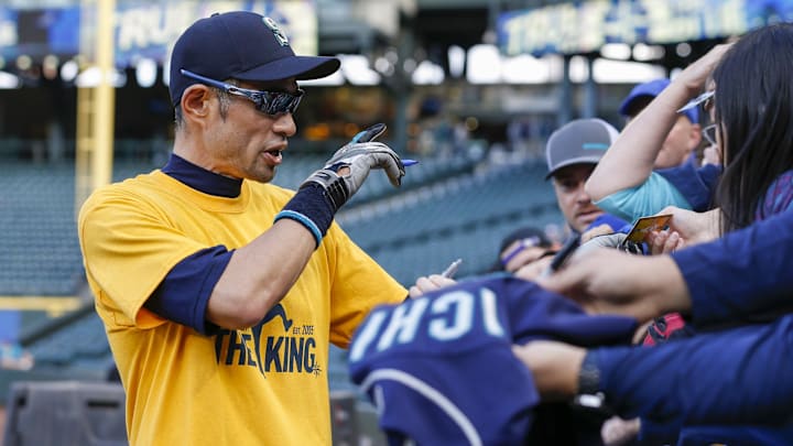 Former Seattle Mariners outfielder Ichiro Suzuki signs autographs for fans before a game on Sept. 26, 2019, at T-Mobile Park.