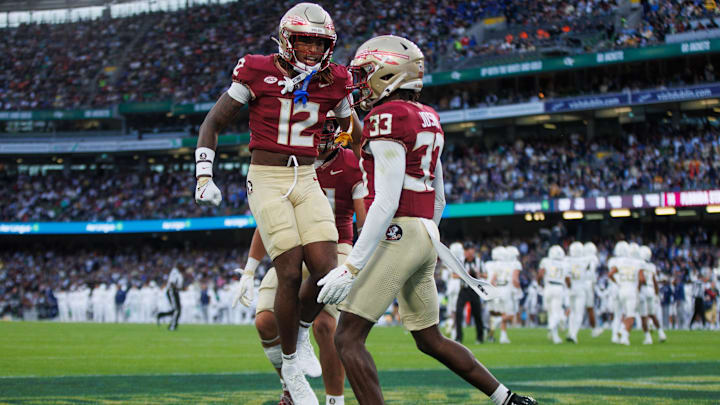 Aug 24, 2024; Dublin, IRL; Florida State University defensive back Edwin Joseph celebrates a tackle against Georgia Tech with defensive back Conrad Hussey at Aviva Stadium. Mandatory Credit: Tom Maher/INPHO via Imagn Images