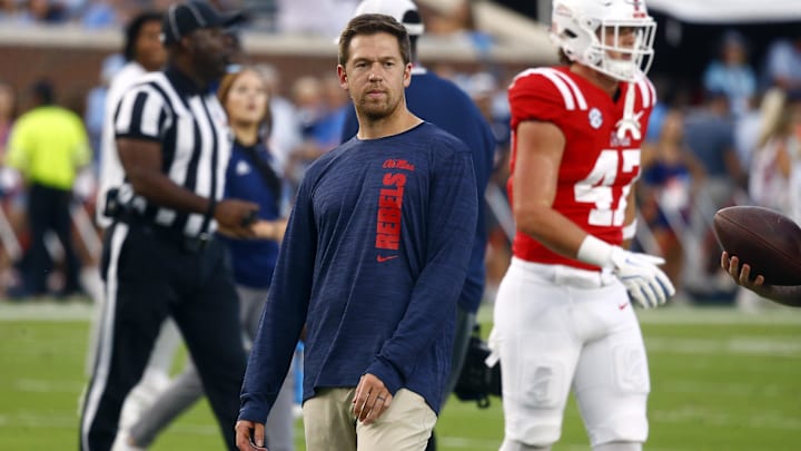 Sep 21, 2024; Oxford, Mississippi, USA; Mississippi Rebels offensive coordinator Charlie Weis Jr. watches during warm ups prior to the game against the Georgia Southern Eagles at Vaught-Hemingway Stadium. Mandatory Credit: Petre Thomas-Imagn Images Sep 21, 2024; Oxford, Mississippi, USA; Mississippi Rebels offensive coordinator Charlie Weis Jr. watches during warm ups prior to the game against the Georgia Southern Eagles at Vaught-Hemingway Stadium. Mandatory Credit: Petre Thomas-Imagn Images