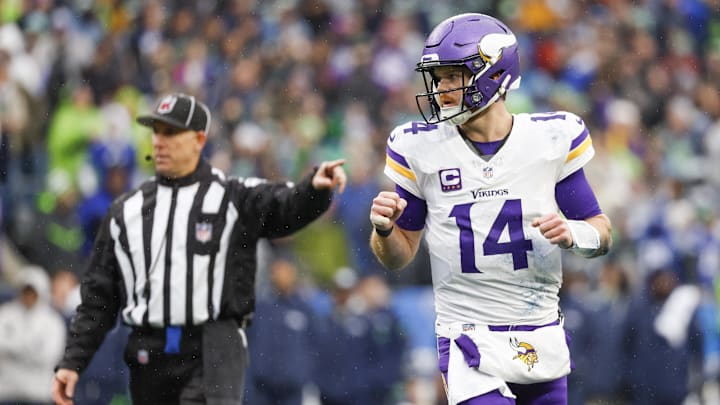 Dec 22, 2024; Seattle, Washington, USA; Minnesota Vikings quarterback Sam Darnold (14) reacts after passing for a touchdown against the Seattle Seahawks during the first quarter at Lumen Field. Mandatory Credit: Joe Nicholson-Imagn Images