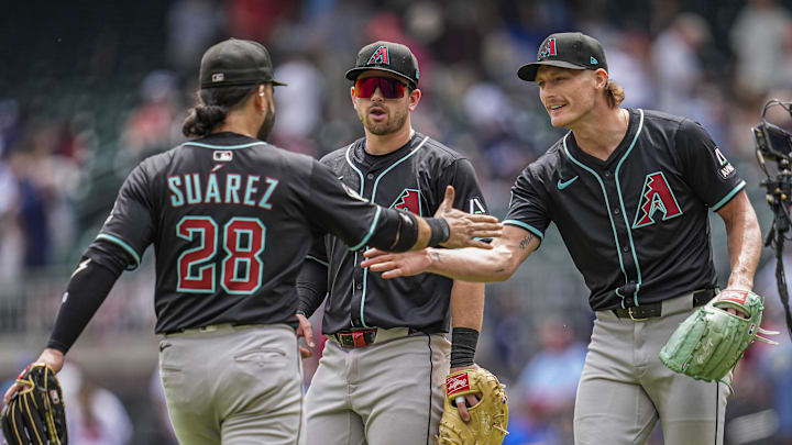 Jun 5, 2025; Cumberland, Georgia, USA; Arizona Diamondbacks third baseman Eugenio Suarez (28) reacts with relief pitcher Shelby Miller (18) after the Diamondbacks defeated the Atlanta Braves at Truist Park. Mandatory Credit: Dale Zanine-Imagn Images Jun 5, 2025; Cumberland, Georgia, USA; Arizona Diamondbacks third baseman Eugenio Suarez (28) reacts with relief pitcher Shelby Miller (18) after the Diamondbacks defeated the Atlanta Braves at Truist Park. Mandatory Credit: Dale Zanine-Imagn Images