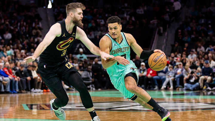 Charlotte Hornets guard Josh Green drives on Cleveland Cavaliers forward Dean Wade during the second quarter at Spectrum Center. Charlotte Hornets guard Josh Green drives on Cleveland Cavaliers forward Dean Wade during the second quarter at Spectrum Center.