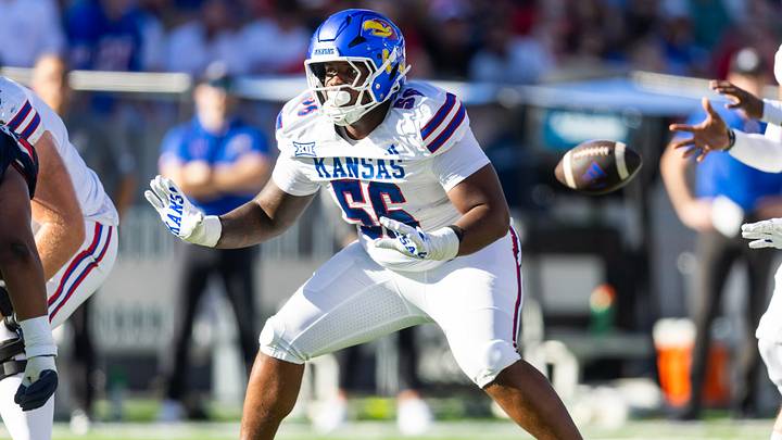Nov 8, 2025; Tucson, Arizona, USA; Kansas Jayhawks offensive lineman Amir Herring (56) against the Arizona Wildcats at Arizona Stadium. Mandatory Credit: Mark J. Rebilas-Imagn Images