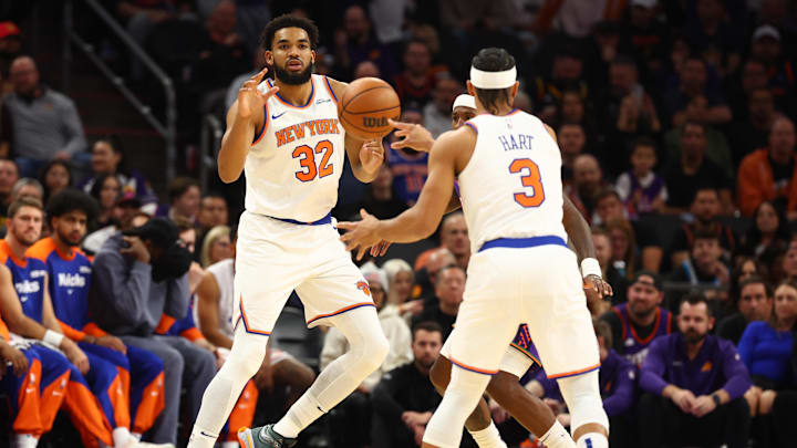 Nov 20, 2024; Phoenix, Arizona, USA; New York Knicks center Karl-Anthony Towns (32) takes a pass from guard Josh Hart (3) against the Phoenix Suns at Footprint Center. Mandatory Credit: Mark J. Rebilas-Imagn Images
