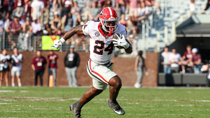 Nov 8, 2025; Starkville, Mississippi, USA; Georgia Bulldogs running back Bo Walker (24) runs with the ball against the Mississippi State Bulldogs during the second half at Davis Wade Stadium at Scott Field. Mandatory Credit: Wesley Hale-Imagn Images Nov 8, 2025; Starkville, Mississippi, USA; Georgia Bulldogs running back Bo Walker (24) runs with the ball against the Mississippi State Bulldogs during the second half at Davis Wade Stadium at Scott Field. Mandatory Credit: Wesley Hale-Imagn Images