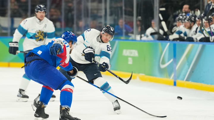 Feb 21, 2026; Milan, Italy; Artturi Lehkonen (62) of Finland passes while defended by Erik Cernak (81) of Slovakia in the first period in the men's ice hockey bronze medal game during the Milano Cortina 2026 Olympic Winter Games at Milano Santagiulia Ice Hockey Arena. Mandatory Credit: Joe Camporeale-Imagn Images Feb 21, 2026; Milan, Italy; Artturi Lehkonen (62) of Finland passes while defended by Erik Cernak (81) of Slovakia in the first period in the men's ice hockey bronze medal game during the Milano Cortina 2026 Olympic Winter Games at Milano Santagiulia Ice Hockey Arena. Mandatory Credit: Joe Camporeale-Imagn Images
