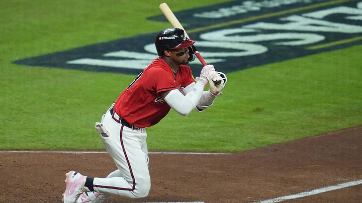 Oct 6, 2026; Cumberland, Georgia, USA;  Atlanta Braves outfielder Ronald Acuna Jr. (13) is out on a batted ball during the fifth inning against the Los Angeles Dodgers at Truist Park.  Mandatory Credit: Dale Zanine-Imagn Images