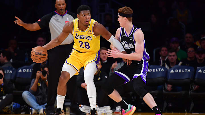 Mar 6, 2024; Los Angeles, California, USA;  Los Angeles Lakers forward Rui Hachimura (28) moves the ball against Sacramento Kings guard Kevin Huerter (9) during the first half at Crypto.com Arena. Mandatory Credit: Gary A. Vasquez-Imagn Images