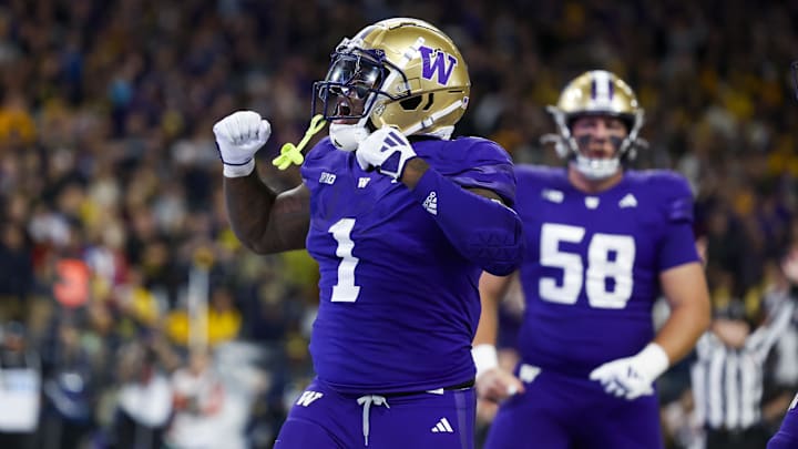 Oct 5, 2024; Seattle, Washington, USA; Washington Huskies running back Jonah Coleman (1) celebrates after rushing for a touchdown against the Michigan Wolverines during the fourth quarter at Alaska Airlines Field at Husky Stadium.