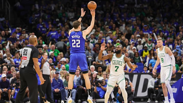 Apr 25, 2025; Orlando, Florida, USA; Orlando Magic forward Franz Wagner (22) shoots a three point basket over Boston Celtics guard Jaylen Brown (7) during the second half of game three of first round for the 2024 NBA Playoffs at Kia Center. Mandatory Credit: Mike Watters-Imagn Images