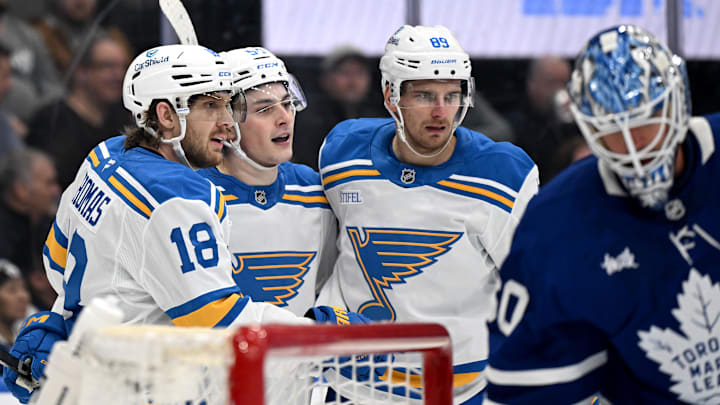 Nov 18, 2025; Toronto, Ontario, CAN;  St. Louis Blues forward Dalibor Dvorsky (54) celebrates with forwards Robert Thomas (18) and Pavel Buchnevich (89) after scoring a goal against the Toronto Maple Leafs in the second period at Scotiabank Arena. Mandatory Credit: Dan Hamilton-Imagn Images