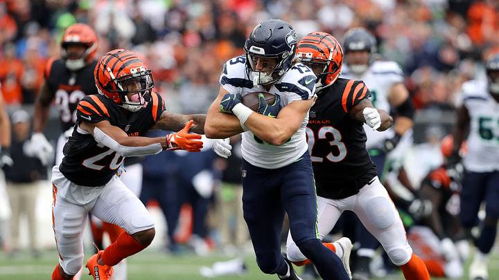 Oct 15, 2023; Cincinnati, Ohio, USA; Seattle Seahawks wide receiver Jake Bobo (19) with a long catch and run as Cincinnati Bengals cornerback DJ Turner II (20) and safety Dax Hill (23) defend during the third quarter at Paycor Stadium. Mandatory Credit: Joseph Maiorana-USA TODAY Sports Oct 15, 2023; Cincinnati, Ohio, USA; Seattle Seahawks wide receiver Jake Bobo (19) with a long catch and run as Cincinnati Bengals cornerback DJ Turner II (20) and safety Dax Hill (23) defend during the third quarter at Paycor Stadium. Mandatory Credit: Joseph Maiorana-USA TODAY Sports