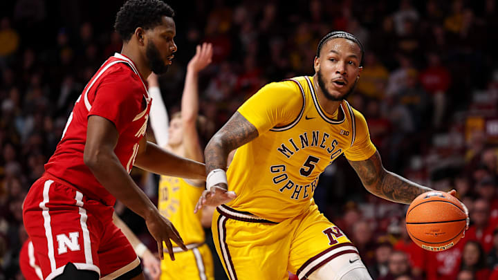 Jan 24, 2026; Minneapolis, Minnesota, USA; Minnesota Golden Gophers forward Jaylen Crocker-Johnson (5) works around Nebraska Cornhuskers forward Jared Garcia (15) during the first half at Williams Arena. Mandatory Credit: Matt Krohn-Imagn Images