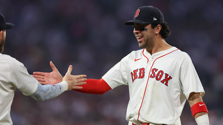 Jun 11, 2025; Boston, Massachusetts, USA; Boston Red Sox third baseman Marcelo Mayer (39) celebrates with Boston Red Sox shortstop Trevor Story (10) during the sixth inning against the Tampa Bay Rays at Fenway Park. Mandatory Credit: Paul Rutherford-Imagn Images
