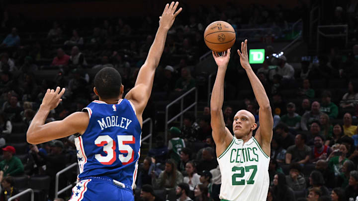 Oct 12, 2024; Boston, Massachusetts, USA; Boston Celtics guard Jordan Walsh (27) attempts a basket against Philadelphia 76ers forward Isaiah Mobley (35) during the second half at the TD Garden. Mandatory Credit: Brian Fluharty-Imagn Images