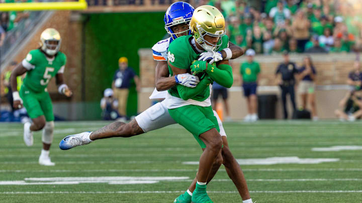 Oct 4, 2025; South Bend, Indiana, USA; Boise State Broncos wide receiver Latrell Caples (3) tackles Notre Dame Fighting Irish cornerback Leonard Moore (15) after he made an interception during the second half at Notre Dame Stadium. Mandatory Credit: Michael Caterina-Imagn Images
