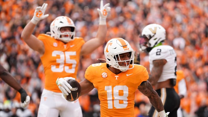Tennessee running back DeSean Bishop (18) and H-back Carson Gentle (35) celebrate after Bishop scores a touchdown in an NCAA college football game against Vanderbilt on Nov. 29, 2025, in Knoxville, Tennessee. Tennessee running back DeSean Bishop (18) and H-back Carson Gentle (35) celebrate after Bishop scores a touchdown in an NCAA college football game against Vanderbilt on Nov. 29, 2025, in Knoxville, Tennessee.