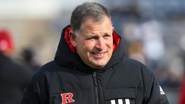 Rutgers Scarlet Knights head coach Greg Schiano walks on the field at Beaver Stadium during warmups prior to a game against the Penn State Nittany Lions. 