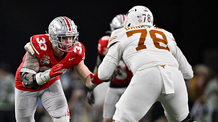 Jan 10, 2025; Arlington, TX, USA; Ohio State Buckeyes defensive end Jack Sawyer (33) rushes against Texas Longhorns offensive lineman Kelvin Banks Jr. (78) during the game at AT&T Stadium. Mandatory Credit: Jerome Miron-Imagn Images
