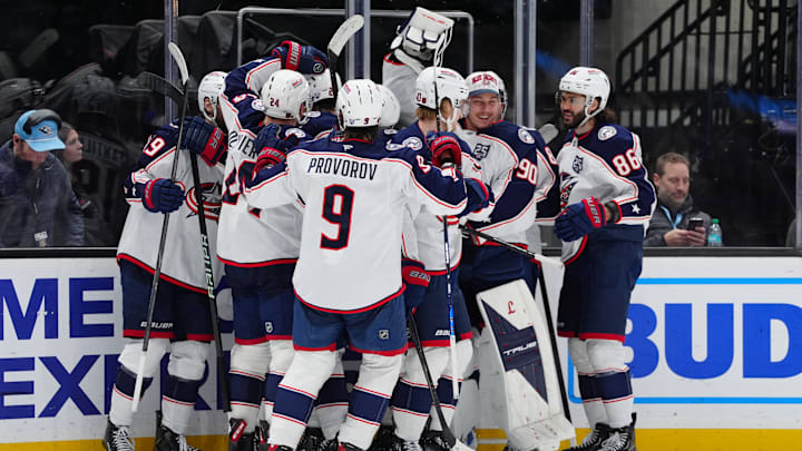 The Blue Jackets celebrate an overtime win against the Utah Mammoth.