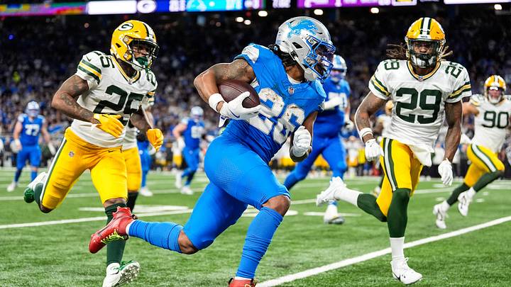 Detroit Lions running back Jahmyr Gibbs runs for a first down against Green Bay Packers safety Xavier McKinney (29) during the second half at Ford Field in Detroit on Thursday, Dec. 5, 2024.