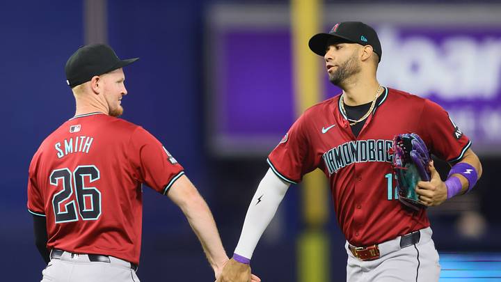 Aug 20, 2024; Miami, Florida, USA; Arizona Diamondbacks left fielder Lourdes Gurriel Jr. (12) celebrates with right fielder Pavin Smith (26) after the game against the Miami Marlins at loanDepot Park. Mandatory Credit: Sam Navarro-USA TODAY Sports Aug 20, 2024; Miami, Florida, USA; Arizona Diamondbacks left fielder Lourdes Gurriel Jr. (12) celebrates with right fielder Pavin Smith (26) after the game against the Miami Marlins at loanDepot Park. Mandatory Credit: Sam Navarro-USA TODAY Sports