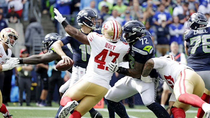 Sep 7, 2025; Seattle, Washington, USA; Seattle Seahawks quarterback Sam Darnold (14) looks to make a pass against San Francisco 49ers during the first half at Lumen Field. Mandatory Credit: Joe Nicholson-Imagn Images