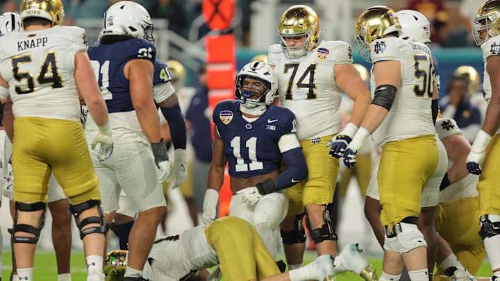 Jan 9, 2025; Miami, FL, USA; Penn State Nittany Lions defensive end Abdul Carter (11) celebrates a tackle on Notre Dame Fighting Irish quarterback Riley Leonard (13) in the first half in the Orange Bowl at Hard Rock Stadium. Jan 9, 2025; Miami, FL, USA; Penn State Nittany Lions defensive end Abdul Carter (11) celebrates a tackle on Notre Dame Fighting Irish quarterback Riley Leonard (13) in the first half in the Orange Bowl at Hard Rock Stadium.