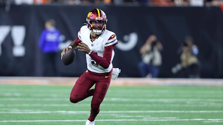 Sep 23, 2024; Cincinnati, Ohio, USA; Washington Commanders quarterback Jayden Daniels (5) runs during the fourth quarter against the Cincinnati Bengals at Paycor Stadium. Mandatory Credit: Joseph Maiorana-Imagn Images Sep 23, 2024; Cincinnati, Ohio, USA; Washington Commanders quarterback Jayden Daniels (5) runs during the fourth quarter against the Cincinnati Bengals at Paycor Stadium. Mandatory Credit: Joseph Maiorana-Imagn Images