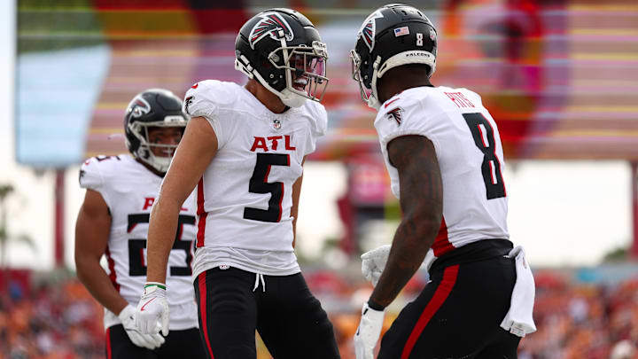 Oct 27, 2024; Tampa, Florida, USA; Atlanta Falcons wide receiver Drake London (5) congratulates tight end Kyle Pitts (8) after scoring a touchdown against the Tampa Bay Buccaneers in the second quarter at Raymond James Stadium. Mandatory Credit: Nathan Ray Seebeck-Imagn Images