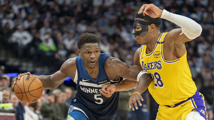 Apr 25, 2025; Minneapolis, Minnesota, USA; Minnesota Timberwolves guard Anthony Edwards (5) dribbles the ball as Los Angeles Lakers forward Rui Hachimura (28) plays defense in the second half during game three of first round for the 2024 NBA Playoffs at Target Center. Mandatory Credit: Jesse Johnson-Imagn Images